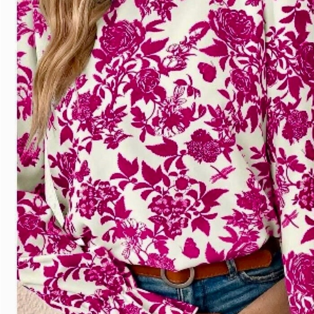 This lovely floral top can be yours!